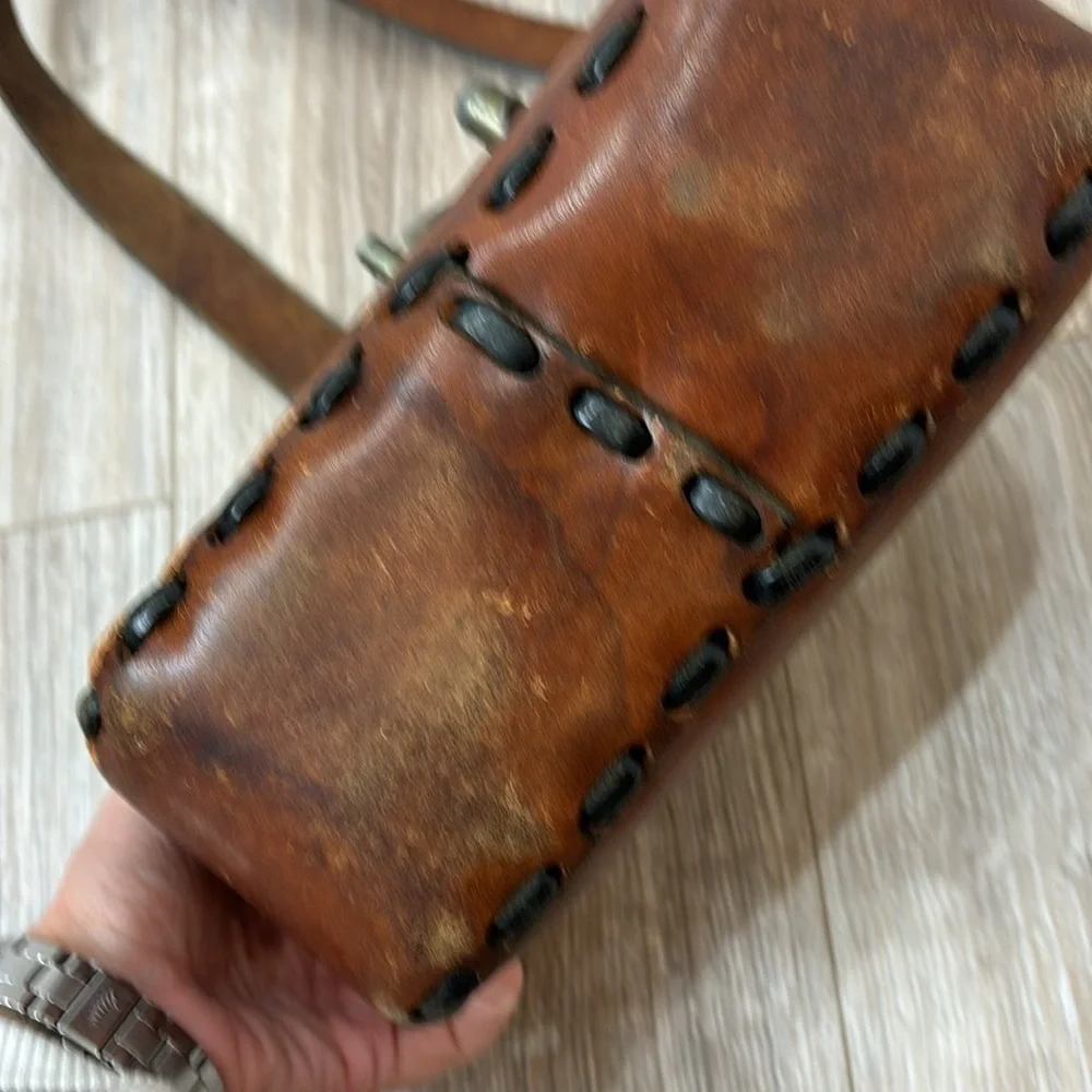 Vintage brown leather MPF BOHO HAND TOOLED PRINTED PURSE WITH HOOK CLOSURE